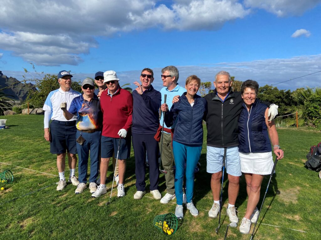 Group of golfers on a golf course.