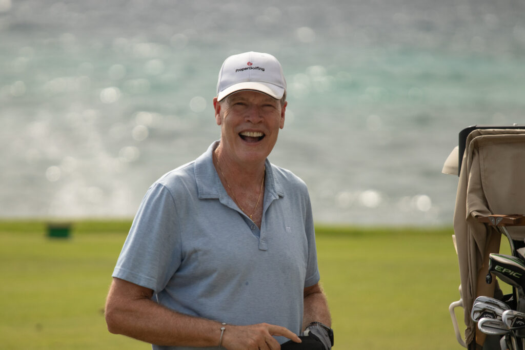 Smiling golfer on golf course.